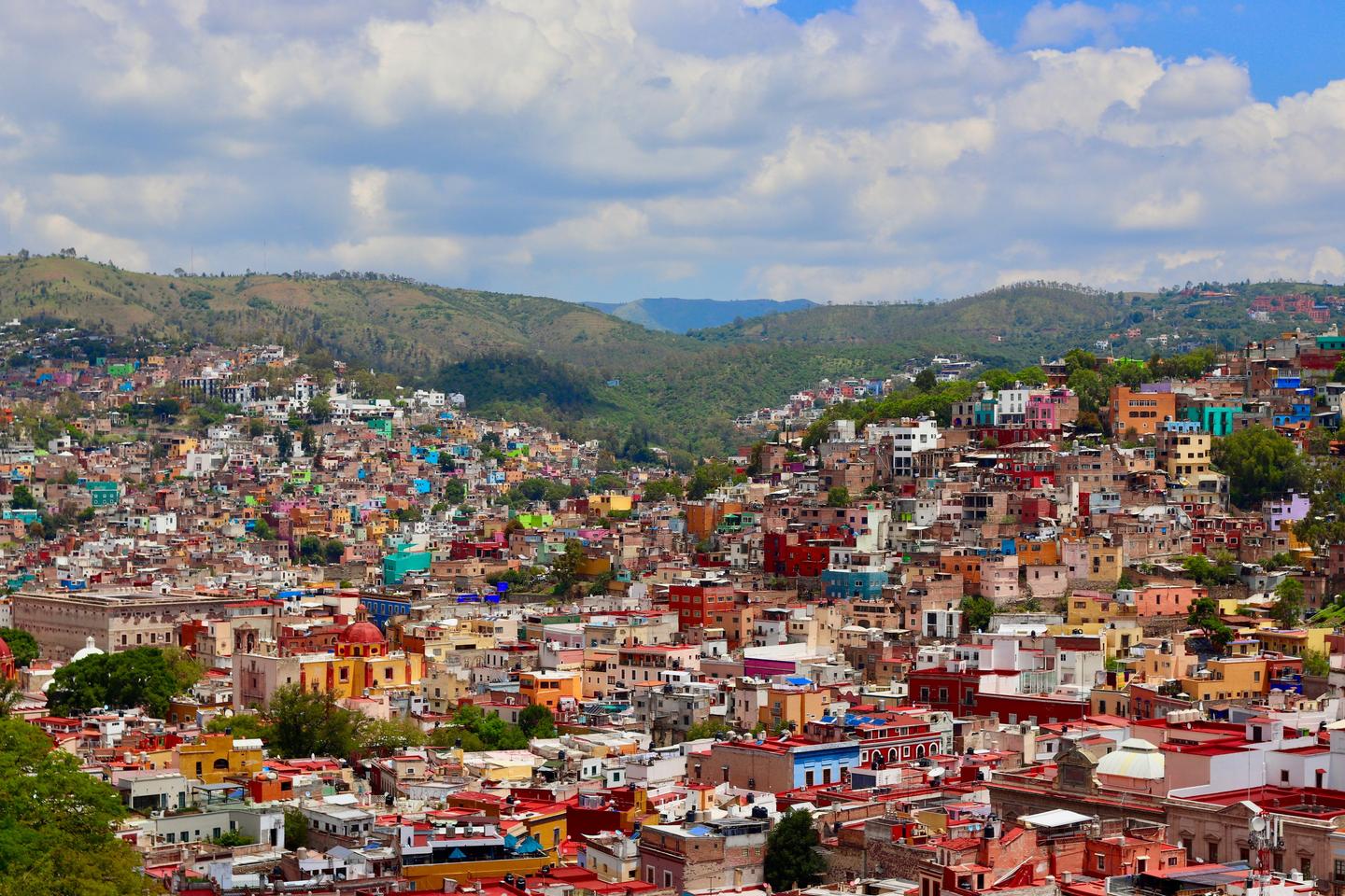 The colorful mountain terrain of Guanajuato City homes flourish on a summer Mexican afternoon.  Viva Mexico.; Shutterstock ID 1454965814; purchase_order: Martin Zoffmann